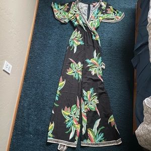 Black Fly Tomato Jumpsuit with Floral Pattern